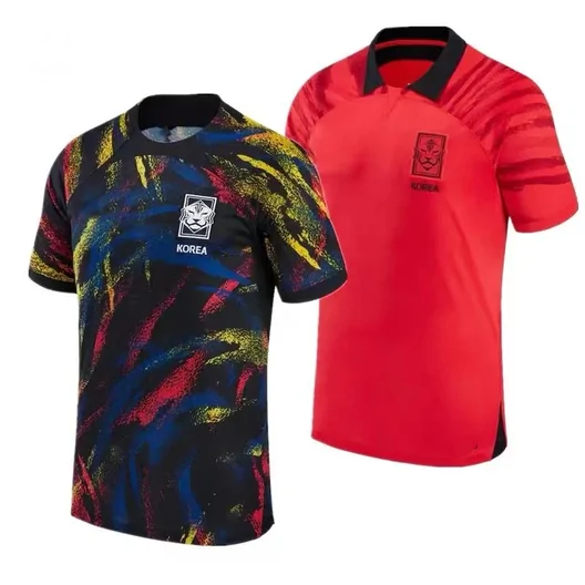 Two football shirts, one with a multicolor brushstroke pattern and one plain red